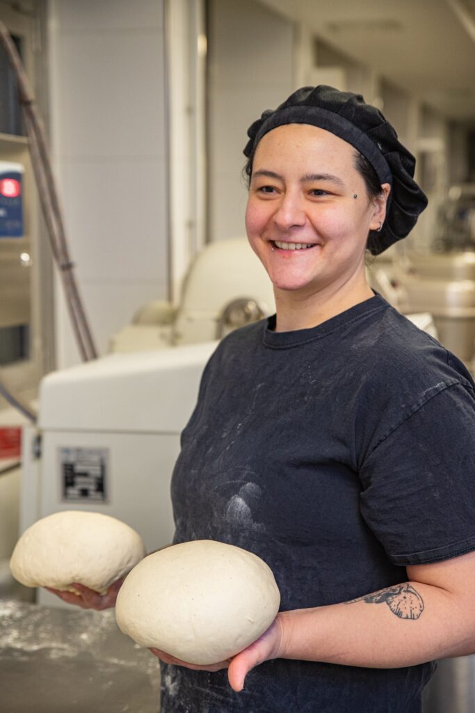 Baker Véronique handling the dough in our bakery. 